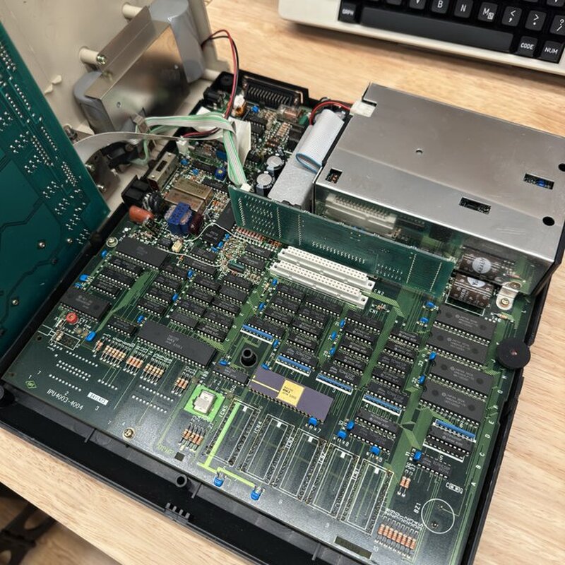 Tandy 600 Update: IT WORKS! After removing the system battery pack and the backup battery, plugging in a tested supply, and performing a 